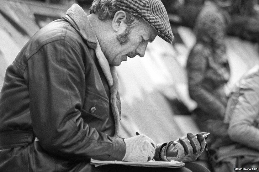 Lotus boss Colin Chapman with clipboard and stopwatch