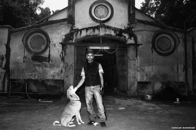 Malcolm Maseyk stands in front of a stable