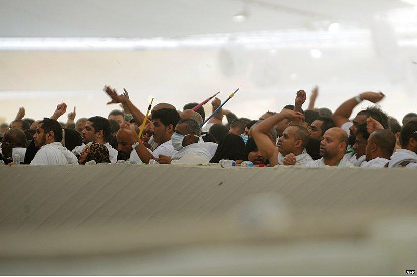 Muslim pilgrims throw pebbles at pillars during the "Jamarat" ritual - the Stoning of the Devil - in Mina near the holy city of Mecca.