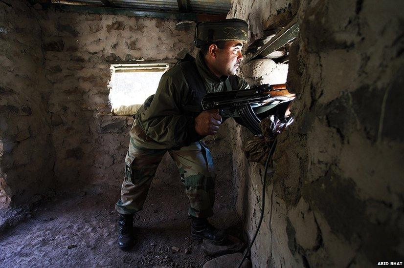 Indian soldier in a bunker on the Line of Control