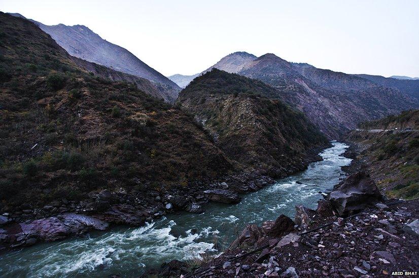 A stream passes through the mountains between Pakistani (left) and Indian (right) sides of Kashmir near the Line of Control near Kaman Post, 118 km north of Srinagar.