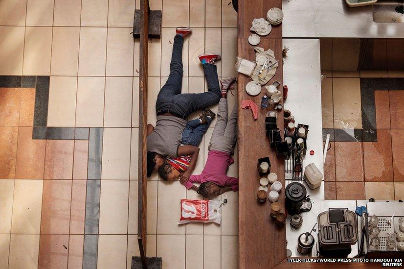 People shelter in the Westgate shopping centre in Nairobi, Kenya