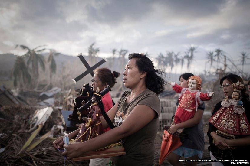 Survivors of typhoon Haiyan marching during a religious procession in Tolosa, Philippines