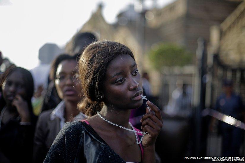 A woman reacting in disappointment after finding out that access to see former South African President Nelson Mandela was closed on the third and final day of his casket lying in state in Pretoria.