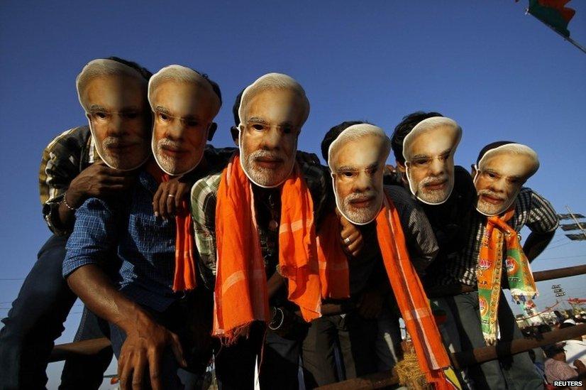 Supporters of Narendra Modi, the prime ministerial candidate for India's main opposition BJP, wear masks of their leader during a rally being addressed by Mr Modi in Chennai.