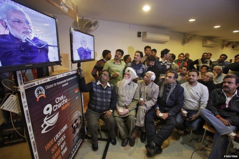 Supporters of Narendra Modi, the prime ministerial candidate for BJP during a live video broadcast campaign on "Talk over tea with Modi", in the northern Indian city of Chandigarh.