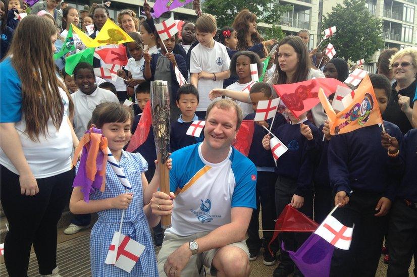 Commonwealth gold medal-winning swimmer Adam Ruckwood with schoolchildren