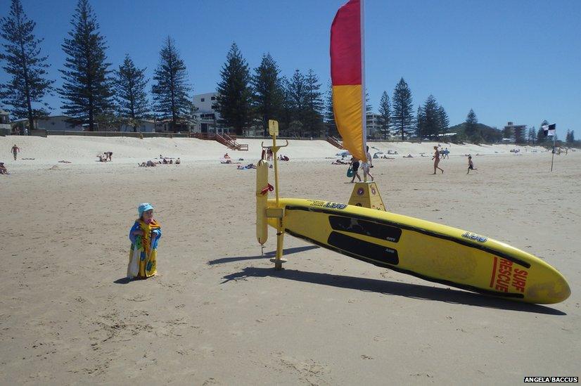 Child and a surfboard