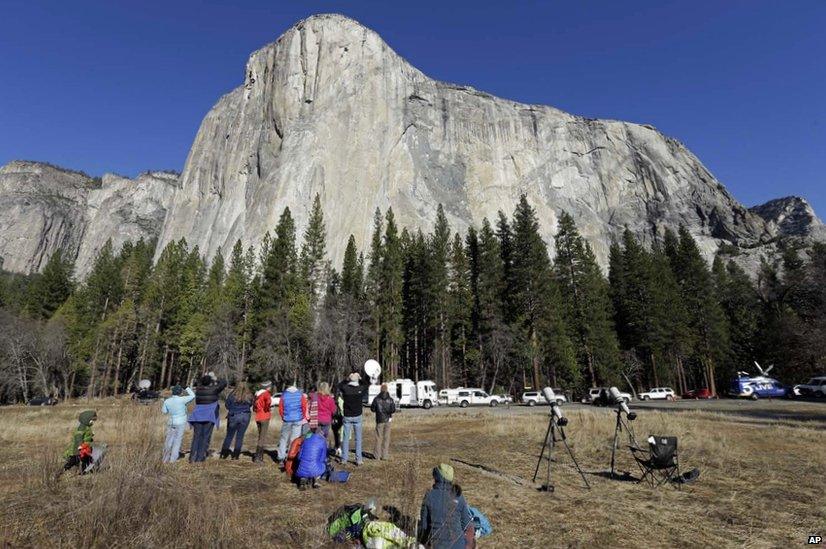 Spectators gaze at El Capitan for a glimpse of climbers Tommy Caldwell and Kevin Jorgeson