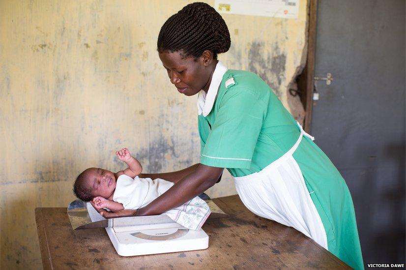 Baby Helen and a nurse