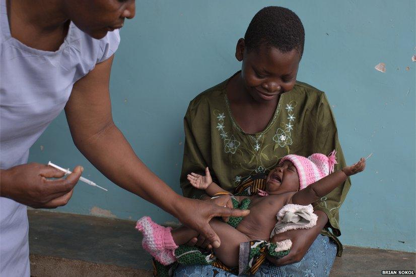 A baby about to be vaccinated