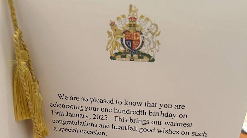 The message inside the card which has the words 'We are so pleased to know that you are celebrating your one hundredth birthday on 19th January, 2025. This brings our warmest congratulations and heartfelt good wishes on such a special occasions.'