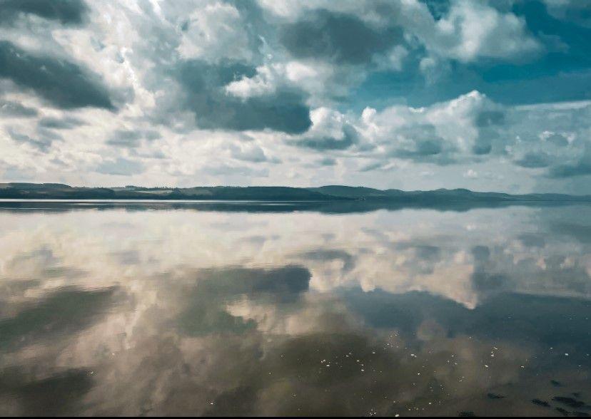 Landscape image of the sky reflected in the River Tay