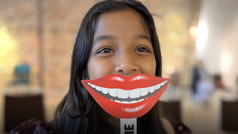 Girl with smiling teeth sign