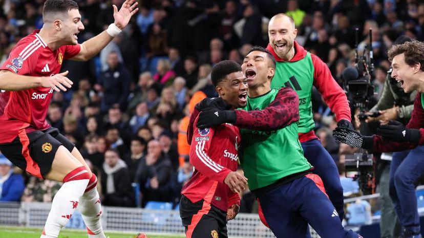 Man Utd celebrate Amad Diallo's late winner at Man City