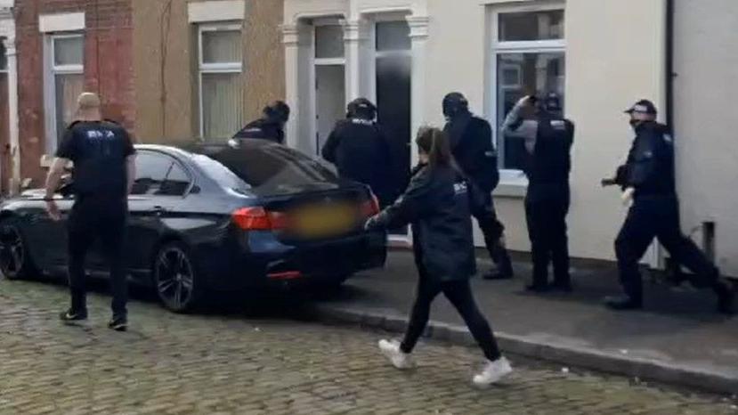 NCA officers raid a house in Preston