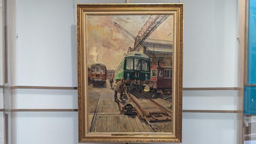 Terence Cuneo painting depicting men working on a train carriage