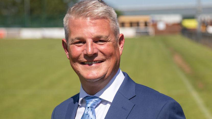 Stuart Andrew in a suit and tie