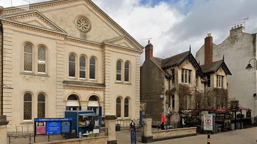 Church building on the opposite side of the street to strip club in Cheltenham. 