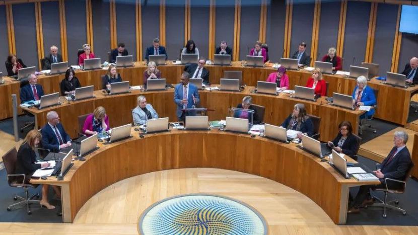 Senedd politicians in the debating chamber