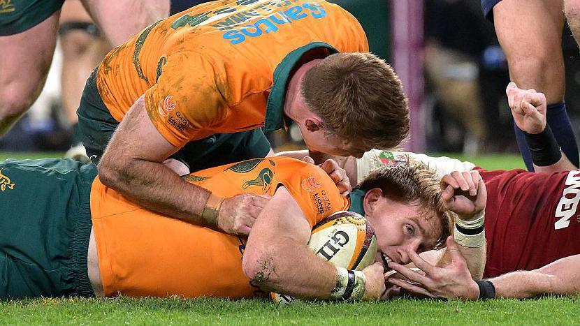 Tate McDermott scores for Australia