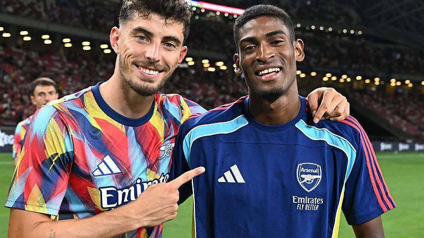 Arsenal forward Kai Havertz points at new Gunners centre-back Cristhian Mosquera