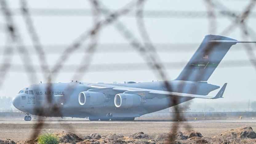 A US Air Force C-17 Globemaster III aircraft carrying undocumented migrants 