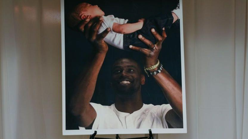 A photograph of Nichols and his son displayed at his funeral in February 2023