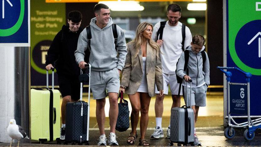 Lennon Miller, father Lee and family at Glasgow Airport