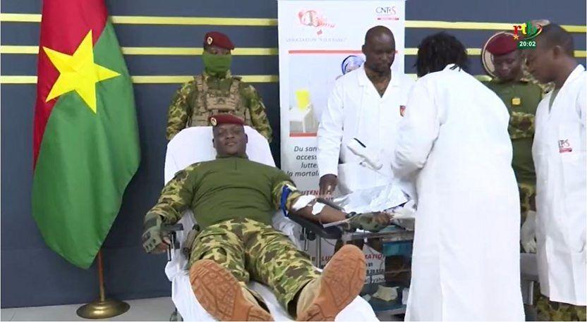 Capt Traoré lies down while giving blood