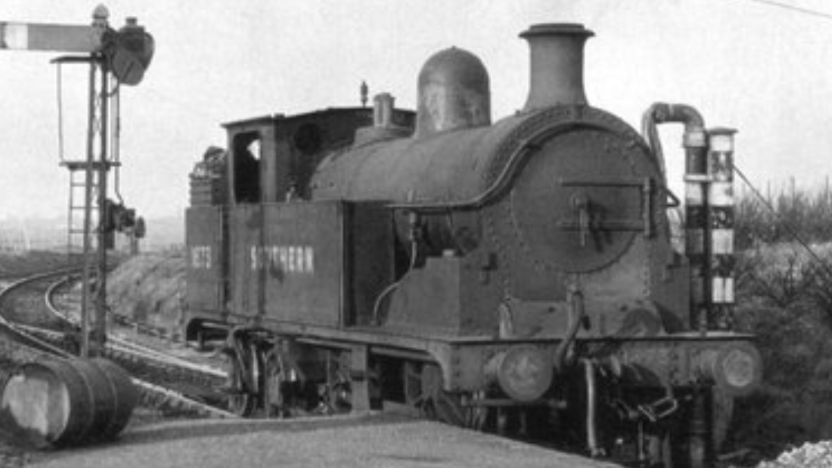 A black and white photograph of a steam train on the Sheppey Light Rail Line pre-1950.