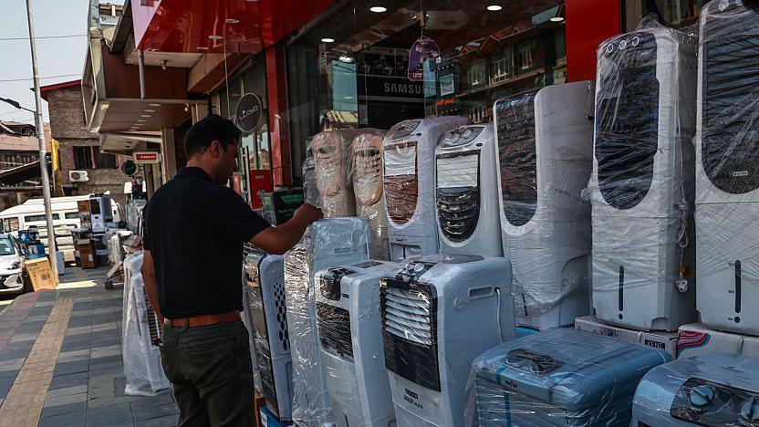 People purchase air coolers, fans, and other cooling equipment amid hot weather conditions in Srinagar, Jammu and Kashmir, India, on June 20, 2025. Kashmir experiences a dramatic and unprecedented rise in maximum temperatures, with several weather stations across the Valley surpassing decades-old records. (Photo by Nasir Kachroo/NurPhoto via Getty Images)