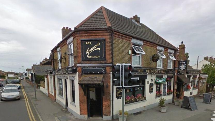 The Halfway House in Halfway between Sheerness and Minster on the Isle of Sheppey, which became Mem's Mezze in 2017. The brown brick building is on two levels, and occupies a junction where two roads meet.