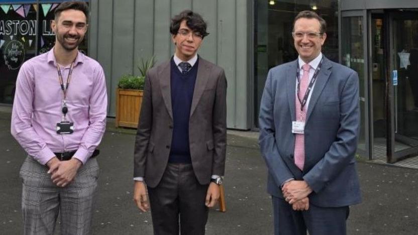 Frazer Roberts (north Africa regional manager), Mohamed Amine Mokrane and Matt Dean standing out The Adrian Cadbury Building at Aston University