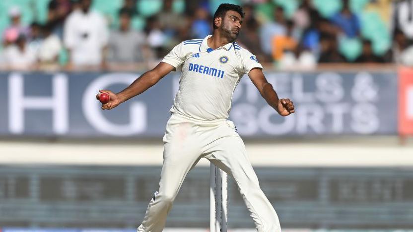  India bowler Ravi Ashwin in bowling action after returning after missing day three during day four of the 3rd Test Match between India and England at Saurashtra Cricket Association Stadium on February 18, 2024 