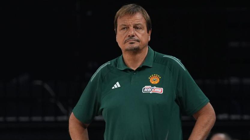 Ergin Ataman wearing a green t-shirt