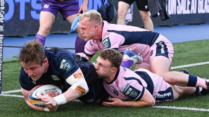 Johnny Matthews plunges over to score the third of Glasgow's six tries