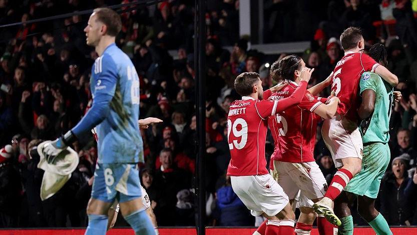 Matz Sels walks off as Wrexham players celebrate