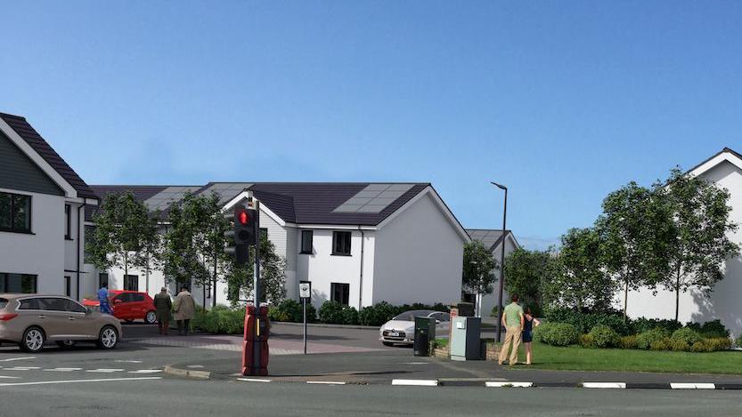 A CGI showing modern white houses from a different angle, there is green space in front.