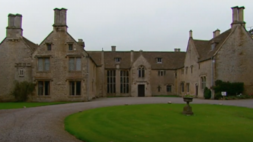 Entrance to house with big lawn outside