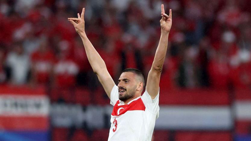 Turkey's Merih Demiral makes a controversial hand gesture as he celebrates scoring 