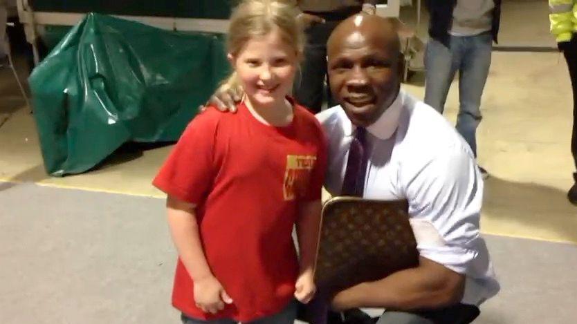 Fran as a child posing with former world champion Chris Eubank, who she knew because her father Mick was a promoter and worked with Eubank Jr.