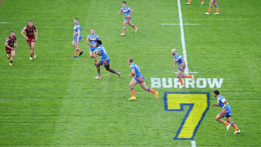 Headingley Stadium with a tribute to Rob Burrow on the pitch during a game