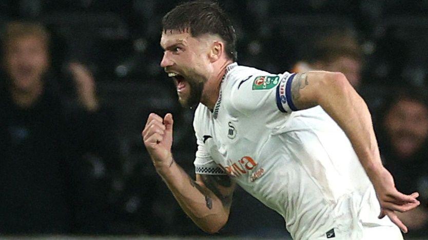 Cameron Burgess celebrates scoring against Notts Forest