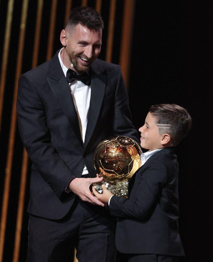 Messi on stage with his son as he receives his 8th Ballon d'Or award.