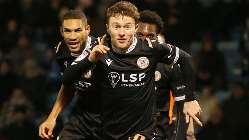 Jude Arthurs (front) celebrates his goal for Bromley against Gillingham