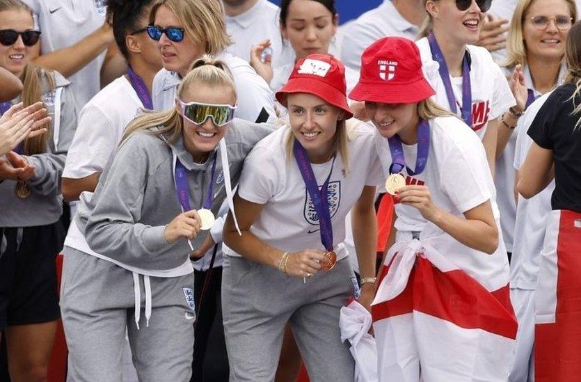 Georgia Stanway, Leah Williamson and Ella Toone show off their winners medals.