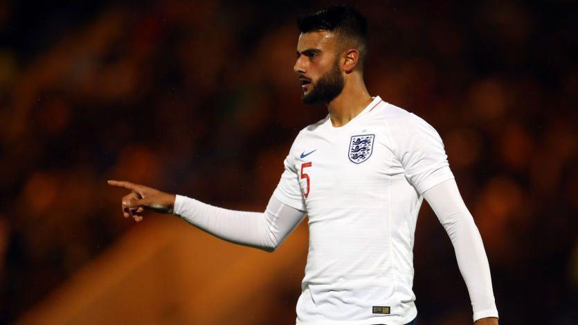 Defender Easah Suliman playing for England under-20 against Germany in 2018