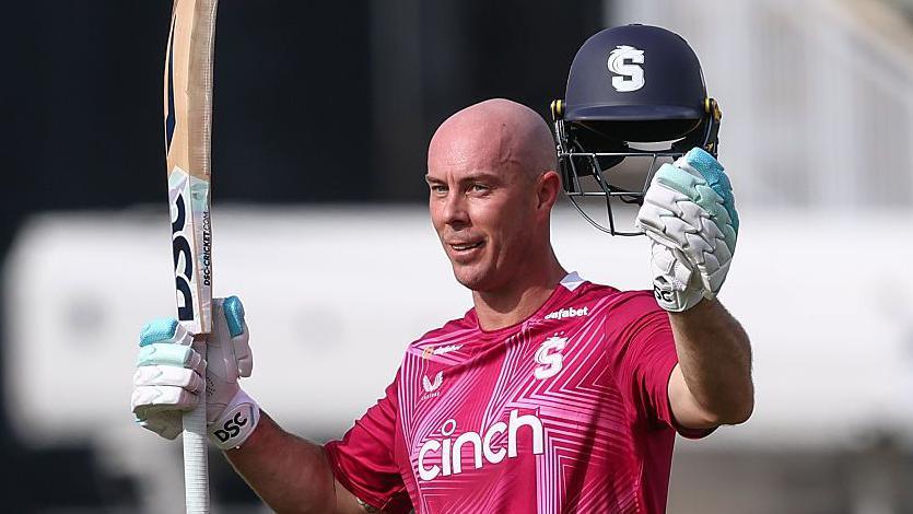 Northamptonshire batter Chris Lynn raises his bat and helmet as he celebrates scoring a century against Warwickshire, at Edgbaston on Sunday 31 May 2026
