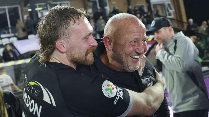 Tom Gordon and Steve Diamond celebrate Newcastle's victory over Exeter